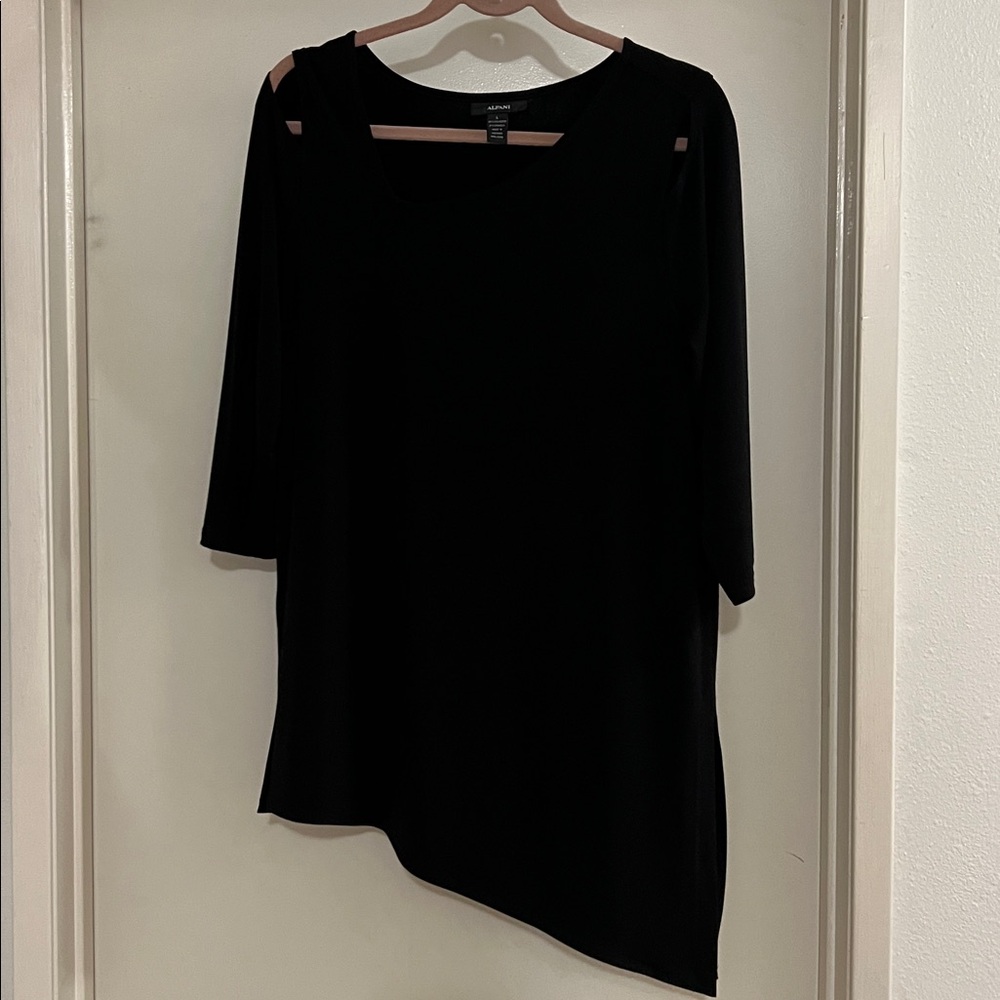 Alfani black top. Cutouts in front by shoulders. Asymmetrical hem. Gently worn